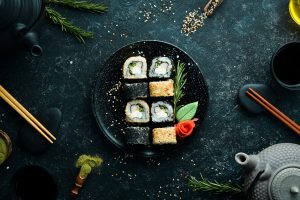 traditional-sushi-black-white-with-crab-cheese-herbs-japanese-cuisine-top-view-2